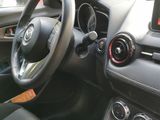 dashboard view of a car with a steering wheel and dashboard controls