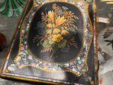 a black box with a picture of a bouquet of flowers on it