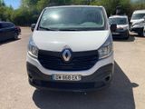 the white van is parked in a parking lot with other cars