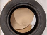 a tire that is inside of a box on the floor