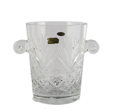 a clear glass vase with a gold coin in it