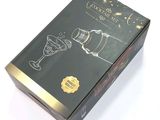 a black box with a drawing of a wine glass in it