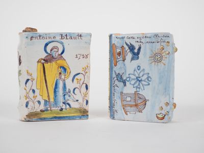 pair of ceramic figurines of saint anthony and saint john