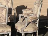 four chairs and a table in a parking lot
