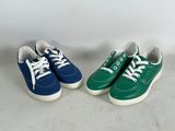 two pairs of green and blue tennis shoes with white laces
