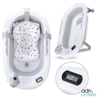 une photo d'un berceau pour bébé équipé d'un thermomètre numérique