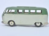 a green and white toy bus on a white surface
