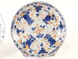 pair of blue and white plates with floral designs on them