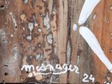 a wooden sign that says manager 24 on it
