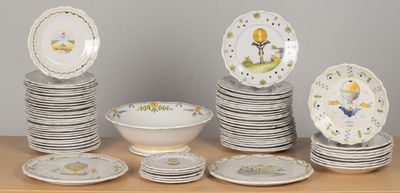 a lot of plates and bowls on the table