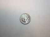 an image of a silver coin on a white surface