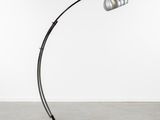 a black and silver floor lamp with a metal shade