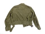 the back of a green jacket with a black tag on it