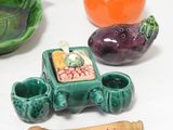 many different types of ceramic objects on the table