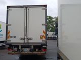 a white truck that is parked in a parking lot