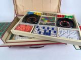 a box with dice and cards in it on a table