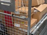 a metal cage with boxes on top of it
