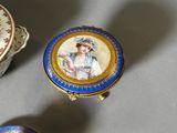 a blue and gold box with a picture of a woman on it