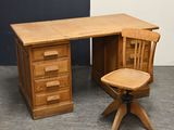 a wooden desk with a wooden chair next to it