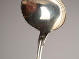 a spoon that is sitting on top of a table