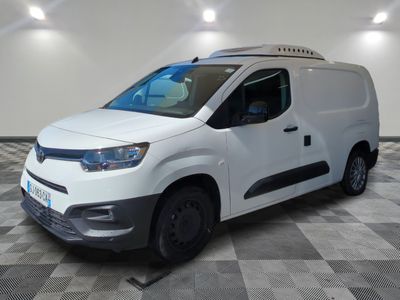 the white van is parked on a checkered tile floor