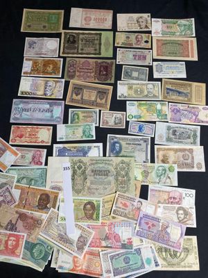 many different types of paper money on the table