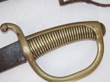 a close up of a sword on a table