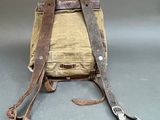 a small bag with a pair of pliers attached to it