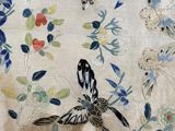 an image of a close up of a table cloth with butterflies and flowers on it