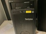 a black computer tower sitting on top of a white table