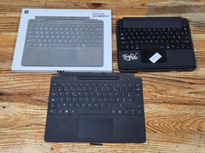 two laptops that are sitting on a wooden table