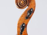 an old violin with a scroll on the back of it