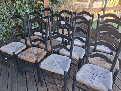 six chairs that are sitting on a wooden deck