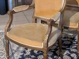 two chairs that are sitting on a rug in a room