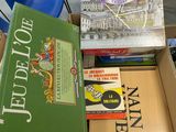 boxes of books are stacked on top of each other in a classroom