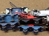 a lot of toy trains that are on the ground