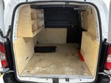 a white van that has been built into the back of it