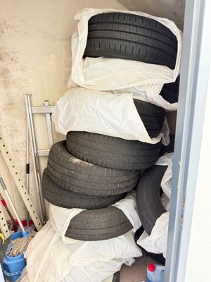 a lot of tires stacked on top of each other