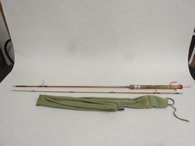 an image of two fishing rods and an umbrella on a white background