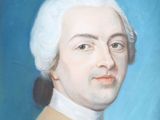 portrait of a man with white hair and a blue background