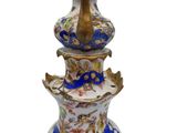 a blue and white vase with a bird on it
