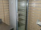 an image of a commercial refrigerator in a kitchen