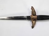 a knife that is laying on top of a table