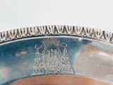 a silver plate with a picture of a castle on it