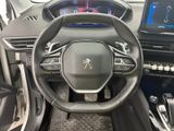 the interior of a car with a steering wheel and dashboard controls