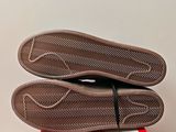 the soles of a pair of shoes are sitting on top of a box