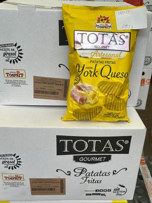 boxes of potato chips are stacked on top of each other in a store