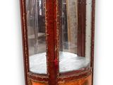 a display cabinet with a glass door in the middle