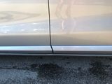 a close up of a car door with a sticker on the side of it
