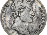 une pièce d'argent représentant la tête d'un homme de profil